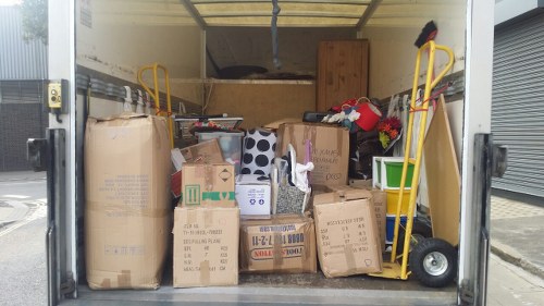 Company van and recycling bins at a commercial site