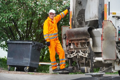 Workers sorting recyclables at a commercial recycling point